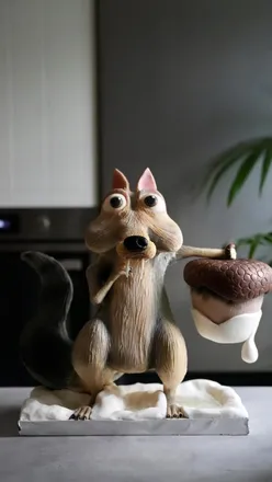 Creative ice age cake with cookies and cream ganache, showcasing detail and artistry from a skilled baker.