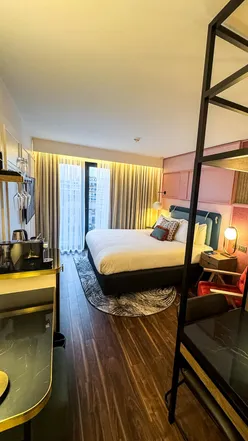 Relaxing stay at The Halyard Hotel in Liverpool with cozy decor, stylish wine glasses, and stunning makeup lighting.