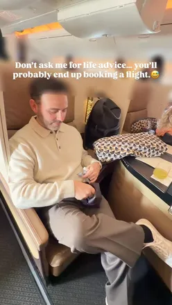 Traveler contemplating life advice with a suitcase, ready for an adventure.