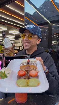 'Indoor view of Rassam’s Creamery in Liverpool, showcasing delicious mini Dutch pancakes and vibrant desserts.'