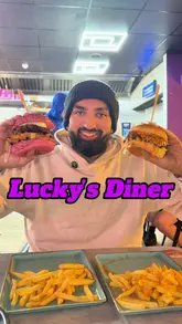 Customers enjoying burgers at the newly opened Lucky's Diner on Paisley Road West, a top spot in the area.