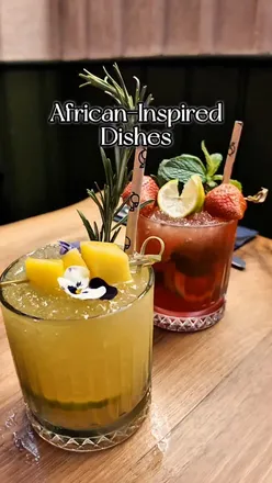 Delicious African-inspired dishes at Afrikana Kitchen: Bunny Chow, Mac and Cheese, Lamb Kebabs, and refreshing mocktails.