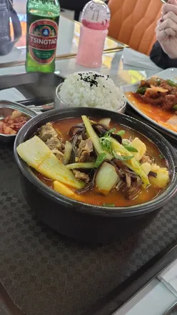 Dinings at Arcadian Food Court in Birmingham featuring Sweet and Sour Pork, Mini Spring Rolls, and Pork Shoulder Soup.