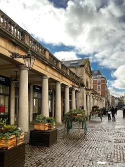 Sunny day in London with vibrant streets and blue skies, perfect weather for sightseeing and outdoor fun.