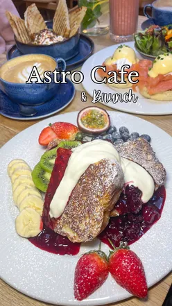 Brunch at Astro Breakfast Cafe in Bethnal Green: eggs Royale, pancakes, and French toast, showcasing delicious halal options.