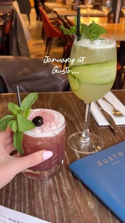 Girls enjoying an Italian feast with dough petals, burrata, carbonara, lasagne, pizza, and tiramisu at Gusto Restaurants.