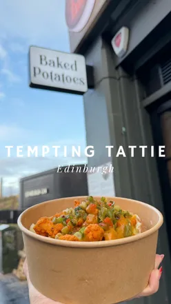 Cozy meal at Tempting Tattie in Edinburgh featuring Dirty Diana and Chak De Chicken dishes.