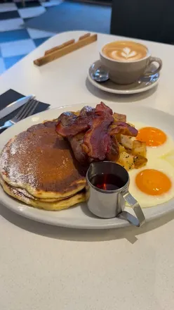 Enjoying a hearty American breakfast at Pickle and Rye in London, featuring classic dishes and cozy ambiance.