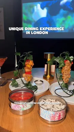 Guests enjoying an immersive cinema experience with a 3-course meal at Taste Film, The Refinery Citypoint, London.