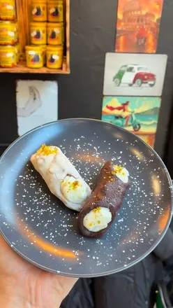 Traditional Italian cafe Bonincontro in Nottingham, serving coffee, pastries, and lunch with unique Vespa seating.