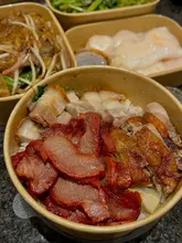Delicious Cantonese takeaway featuring crispy pork belly, prawn cheung fun, dumplings, and chicken satay from The Good Fortune.