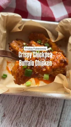 Buffalo crispy chickpea chicken strips served with spicy sauce and garlic dip, a healthy gluten-free alternative.