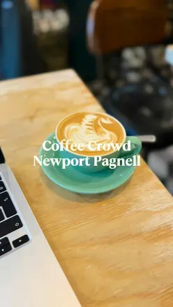 Coffee lovers enjoying flat whites at CoffeeCrowdUK on Newport Pagnell high street, a cherished community space.