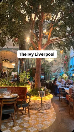 Lunch at The Ivy Liverpool featuring chicken skewers, fishcake, and prosecco in a chic setting.
