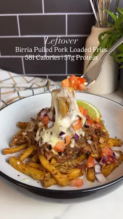 Delicious leftover birria pork loaded fries topped with cheese and fresh ingredients for a satisfying, high-protein meal.