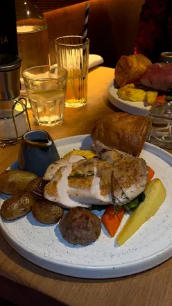 Delicious roast from La Storia in West Bridgford, showcasing vibrant flavors and comfort food on a plate.