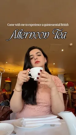 Enjoying a luxurious afternoon tea with vanilla chai, scones, and delicate pastries at Rubens Hotel in London.