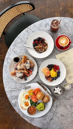 Elevated breakfast at Duck and Waffle: iconic dishes like Full Elvis and Full English with unique twists.
