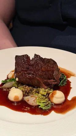 Fine dining at The Lighthouse Restaurant onboard Fingal in Leith, showcasing gourmet dishes and unique cocktails.