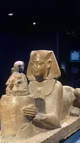 A promotional video showcasing the 'Ramses & the Gold of the Pharaohs' exhibition in London. The video features a montage of various ancient Egyptian artifacts, statues, and immersive digital displays, providing a visual tour of the exhibition's contents.