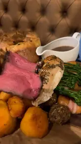 A short, handheld montage showcasing a Sunday roast dinner and drinks at a venue called Poco. The video features shots of the restaurant interior, a toast with wine, and close-ups of the roast dinner being served.