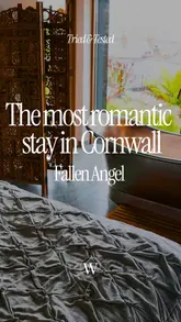 A visually stunning tour of 'The Fallen Angel' in Mousehole, Cornwall, showcasing its luxury interior, romantic atmosphere, and scenic views. The video highlights the unique design, the 'heavenly' bathtub, the fireplace, and the option for in-house pampering and private dining.