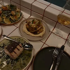 Delicious small plates at @_long_friday_ in Newcastle, featuring focaccia, duck leg, and a stunning wine selection.