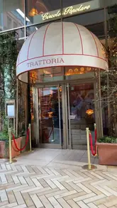 A montage showcasing the interior and food at Circolo Popolare, featuring shots of the restaurant's unique decor, burrata, pizza, and truffle pasta.