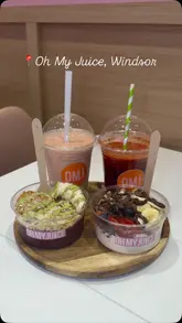 A montage video showcasing the preparation and final presentation of various juices, smoothies, and smoothie bowls at a juice bar. The video features stable, well-lit shots of the blending process and the finished products on a table, providing a clear view of the menu offerings.
