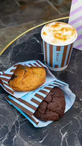 A short, aesthetic montage showcasing the Bear St Bakery mobile truck, its menu, and a selection of cookies and drinks.