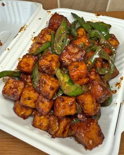 🍽 𝗜𝗻𝗱𝗼-𝗖𝗵𝗶𝗻𝗲𝘀𝗲 𝗳𝗶𝘅 😋

It’s been a while since we have had our regular Indo-Chinese fix from @tangoerestaurant . 

What we had:
🍽 Chilli paneer
🍽 Crispy aubergines
🍽 Veg manchurian
📍 @tangoerestaurant 

The number of times we order from Tangoes, we’d fill out a stamp rewards scheme easily if they ever had one! It’s our favourite spot to order takeaway from, as you can call up and collect within 15 minutes. It’s helpful when we’re tied up with work commitments. Even though we haven’t eaten at the restaurant, it’s always busy and hard to get a table. We can imagine it being even better to eat there.

The crown for best chilli paneer has to go here. It’s been consistent throughout the years we have been eating it. It’s not too saucy yet carries so much flavour wrapped around every paneer piece. It’s added with peppers and green chillies and if you dare have the green chilli, be prepared to handle the heat and a sweet drink by your side to cool off.

Another dish we love to have is the crispy aubergine. The aubergines are cut into strips and fried to a crispy crunch. You wonder how these hold so much flavour in the batter and then have the Indo-Chinese taste come through. They should try doing these with okra.

Lastly, we have taken a liking to the veg manchurian as a starter dish. This is slightly less saucy than the mains which is a curry. These are veggie doughballs mixed with vegetables and then fried. Then it’s tossed in a tangy, savoury and spicy sauce. You really can taste the ginger and garlic in the sauce.

🔴 Follow, comment and share on where we eat our wages

#IEatMyWages #Leicester #IndoChinese #Takeaway #Veg