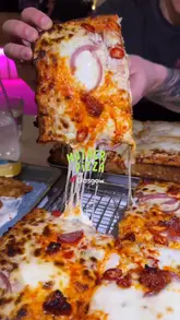 A short, punchy reel showcasing focaccia-style pizza at Mother Pizza in Glasgow, featuring close-up cheese pulls and shots of the venue's interior.