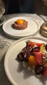 A video showcasing a dinner experience at 'Fore' restaurant in Hertford House. The reel features the venue's interior, the menu, wine service, and a variety of dishes including steak tartare, pan-fried chicken, and desserts.