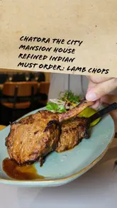 A review of Chatora, an Indian restaurant in the City of London, featuring a variety of dishes including ghee-smoked lamb chops, gunpowder squid, and yakhni chicken pulao. The video highlights the refined atmosphere and the quality of the food, with the creator providing commentary on the dishes.