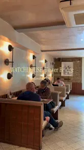 A short, aesthetic montage showcasing the interior and offerings of WatchHouse at Tower Bridge. The video features quick cuts of the exterior, the coffee bar, staff preparing drinks, a display of pastries, and a final shot of an iced coffee.