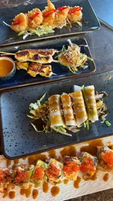 A promotional reel for Teppan3 in Belfast, featuring a variety of Japanese dishes and the restaurant's signature live teppanyaki cooking show. The video highlights the interactive dining experience, showcasing the chef's skills and the range of food available, including sushi, skewers, and teppanyaki mains.