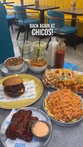 A fast-paced, engaging food review reel showcasing various dishes at Chicos, including a brisket smash burger, mozzarella sticks, and loaded fries, while highlighting their current happy hour offer.