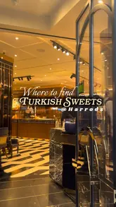 A short, montage-style video showcasing a Turkish dessert cafe near Harrods. The video features close-up shots of various Turkish sweets, including baklava, Turkish delight, and puddings, alongside shots of Turkish tea. The editing is quick and rhythmic, highlighting the variety of products available.