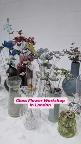 A short video showcasing a lampworking glass-making workshop. The footage captures the process of melting and shaping glass into flowers and butterfly rings, highlighting the creative and hands-on nature of the experience.