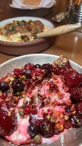 A promotional video for a restaurant in Central London showcasing their newly launched breakfast menu. The video features close-up shots of various dishes, including granola, an omelette, and flatbreads with dips, interspersed with shots of the restaurant's interior decor.
