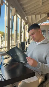 The video is a vlog-style review of The Compleat Angler hotel in Marlow, showcasing the room, the riverside views, the restaurant, and the food. It features the creator enjoying the amenities, including drinks by the water and a multi-course dinner.