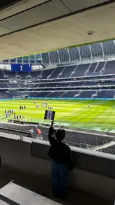 The video documents a family trip to the Tottenham Hotspur Stadium to watch a women's football match. It highlights the accessibility of the stadium, the family-friendly environment, and the 'Lilywhite Experience' which includes private dining and premium seating.