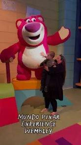 A montage video showing a mother and her young son exploring the Mundo Pixar Experience in London. The video features various interactive sets based on popular Pixar films, including Toy Story, Monsters Inc., and Up, highlighting the family-friendly nature of the attraction.