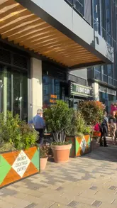 A promotional video showcasing the launch of a new Flight Club venue in Reading. The video features quick cuts of the interior, the dart games, the bar area, and various food items like sliders, tacos, and pizza, highlighting the venue's suitability for social gatherings.