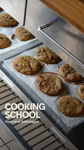 The video documents a three-day residential cookery school experience at Ballintaggart in Scotland. It features a montage of the cooking process, including making sourdough, cookies, and choux pastry, as well as the dining experience and the accommodation.