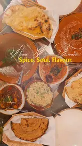 A promotional reel for 'House of Flavours' in Reading, showcasing a variety of Indian dishes, cocktails, and the restaurant's interior atmosphere, including live music.