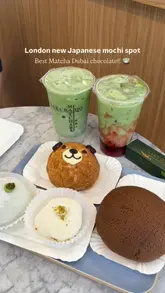 A short, punchy review of a Japanese bakery in London, highlighting their new matcha-based treats, mochi, and coffee bun breakfast deals. The video uses close-up shots to demonstrate the texture of the food and shows the preparation process.