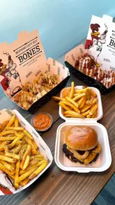 A short, punchy montage of various fried chicken dishes, burgers, and fries, focusing on the textures and sauces of the food. The video uses close-up shots to emphasize the quality and appeal of the meal, set to music without any voiceover or text overlays.