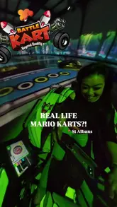 A fast-paced, energetic vlog showcasing an immersive real-life Mario Kart experience in St Albans. The video features the creator and friends participating in various game modes, clearly demonstrating the gameplay mechanics and the fun atmosphere of the venue.