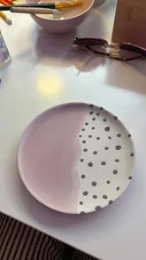 A montage video showing a group of friends enjoying a pottery painting session at Club Pottery. The video highlights the creative process, the BYOB aspect with prosecco, and the finished pottery pieces, capturing the social and therapeutic nature of the activity.